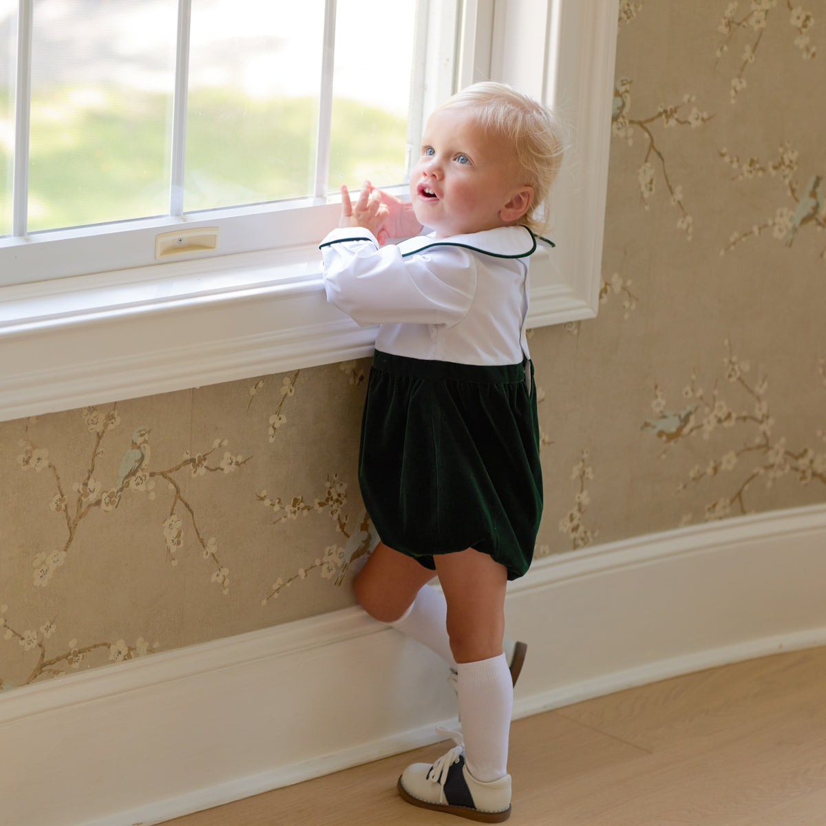 Boys’ Beau Bubble with crisp white long-sleeve cotton poplin top, green piping at the Peter Pan collar and cuffs, and gathered Grafton Green Velvet bottom.