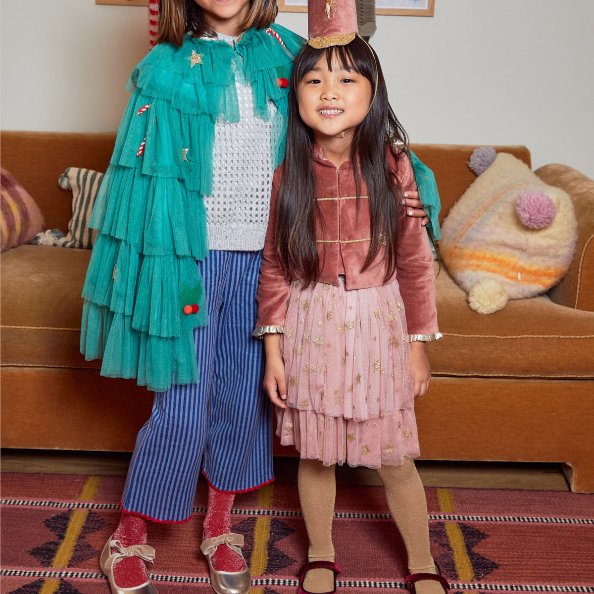 Meri Meri x Marjen Bowie burgundy velvet Mary Jane with gold bow embroidery, two children standing together