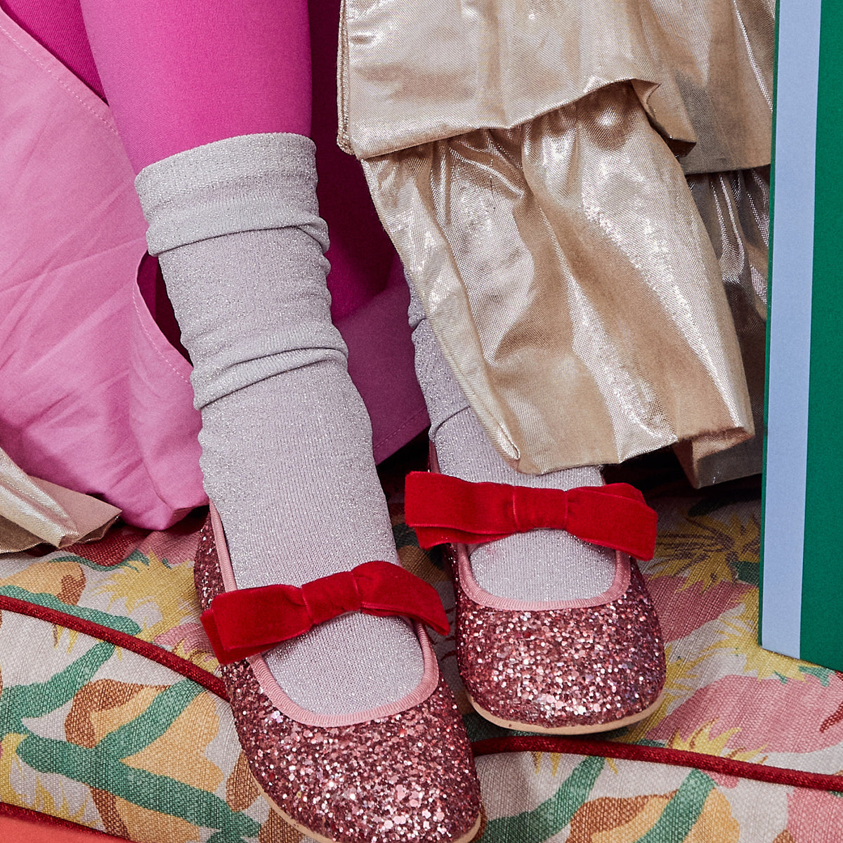 Meri Meri x Marjen Sabrina pink glitter Mary Jane with red velvet bow, close-up worn with silver socks
