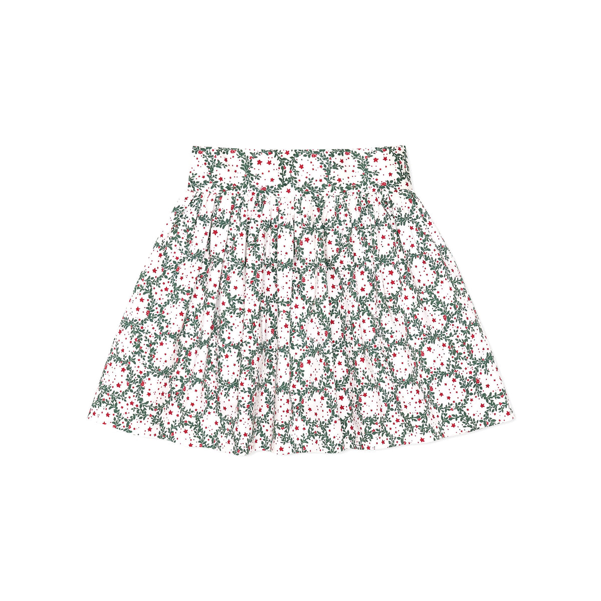 Girls’ Sutton Skirt in Regent Wreaths, featuring a festive green wreath and red star print on white with a full gathered silhouette.