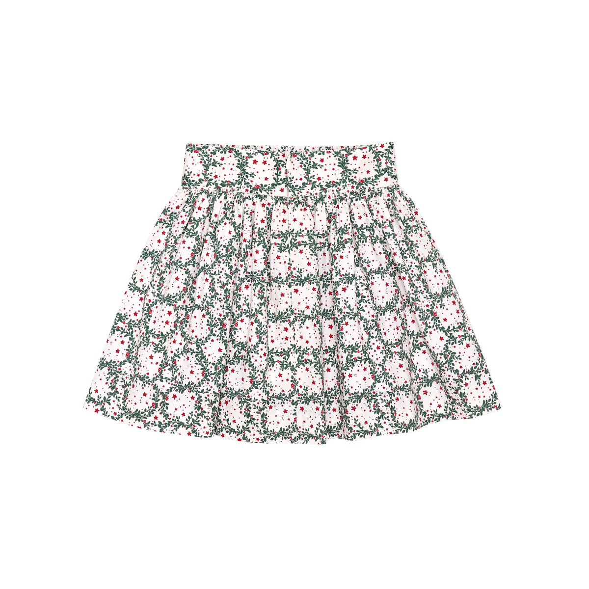 Girls’ Sutton Skirt in Regent Wreaths, featuring a festive green wreath and red star print on white with a full gathered silhouette.