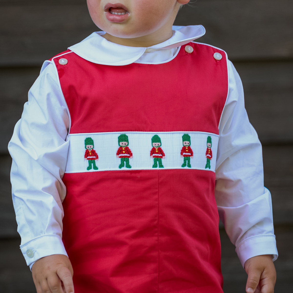 Red boys holiday Jon Jon with toy soldier smocking across the chest, Henry Duvall George Jon Jon in cotton poplin for classic Christmas dressing