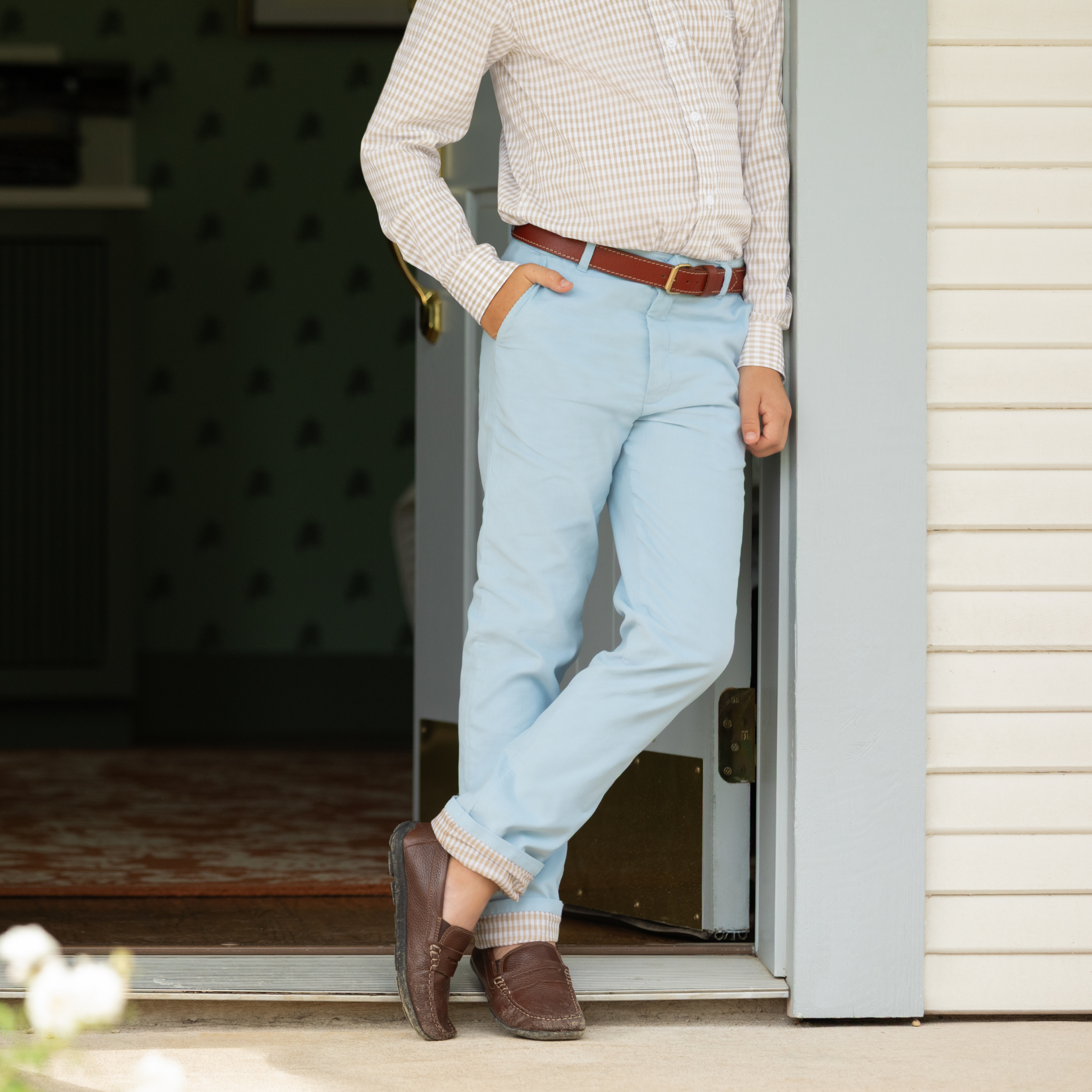 Henry Duvall Bradford Trousers in Bay Tree Blue light blue corduroy for boys, fully lined in King’s Way Khaki Check with contrast checked cuffs that can be rolled up or worn down.