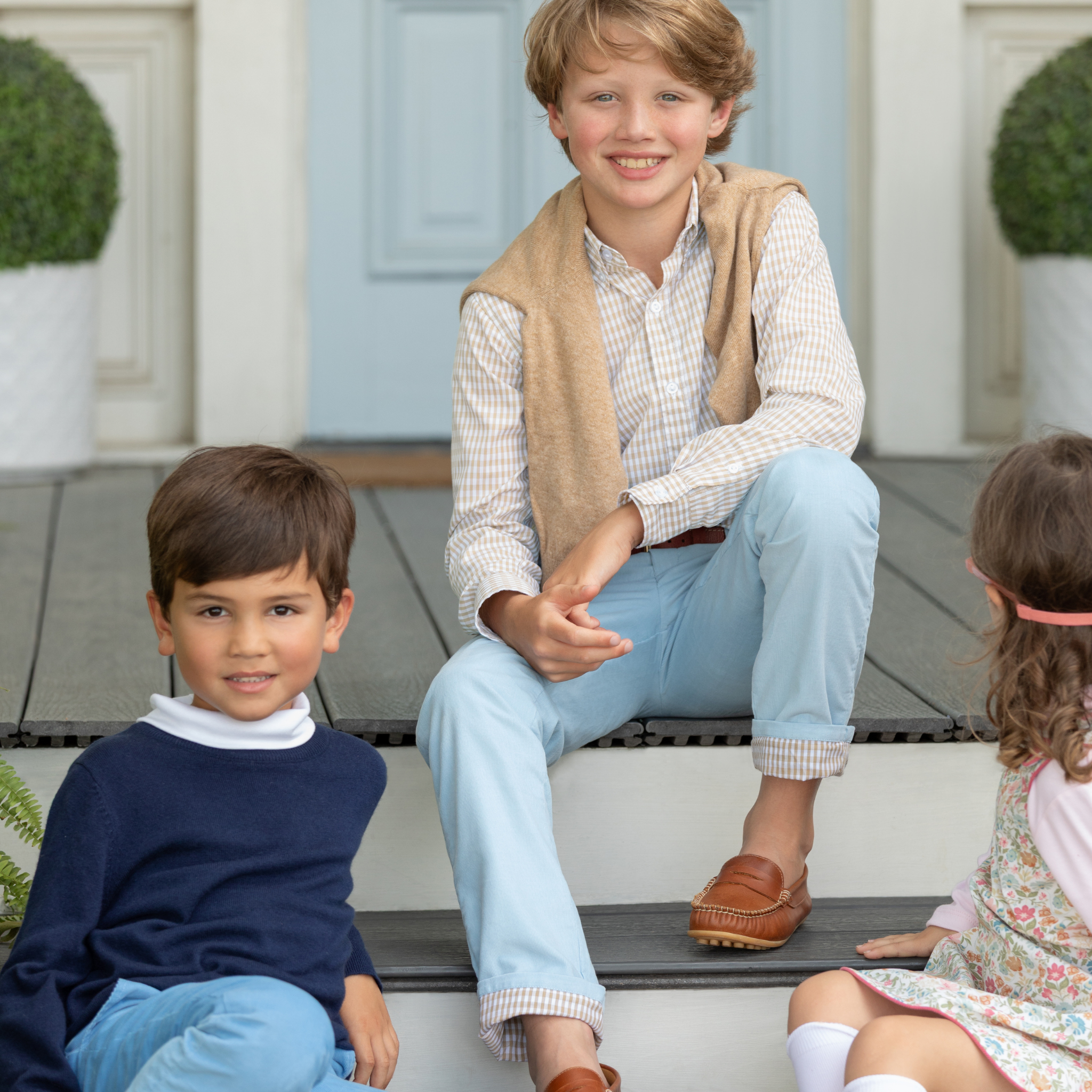 Henry Duvall Bradford Trousers in Bay Tree Blue light blue corduroy for boys, fully lined in King’s Way Khaki Check with contrast checked cuffs that can be rolled up or worn down.