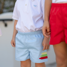 Henry Duvall Liam Shorts in Bailey's Bay Blue with crayon appliqué, classic boys back-to-school shorts with elastic waist for first day of school photos and everyday fall wear.