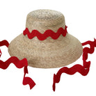 Straw hat with red ribbon on a white background