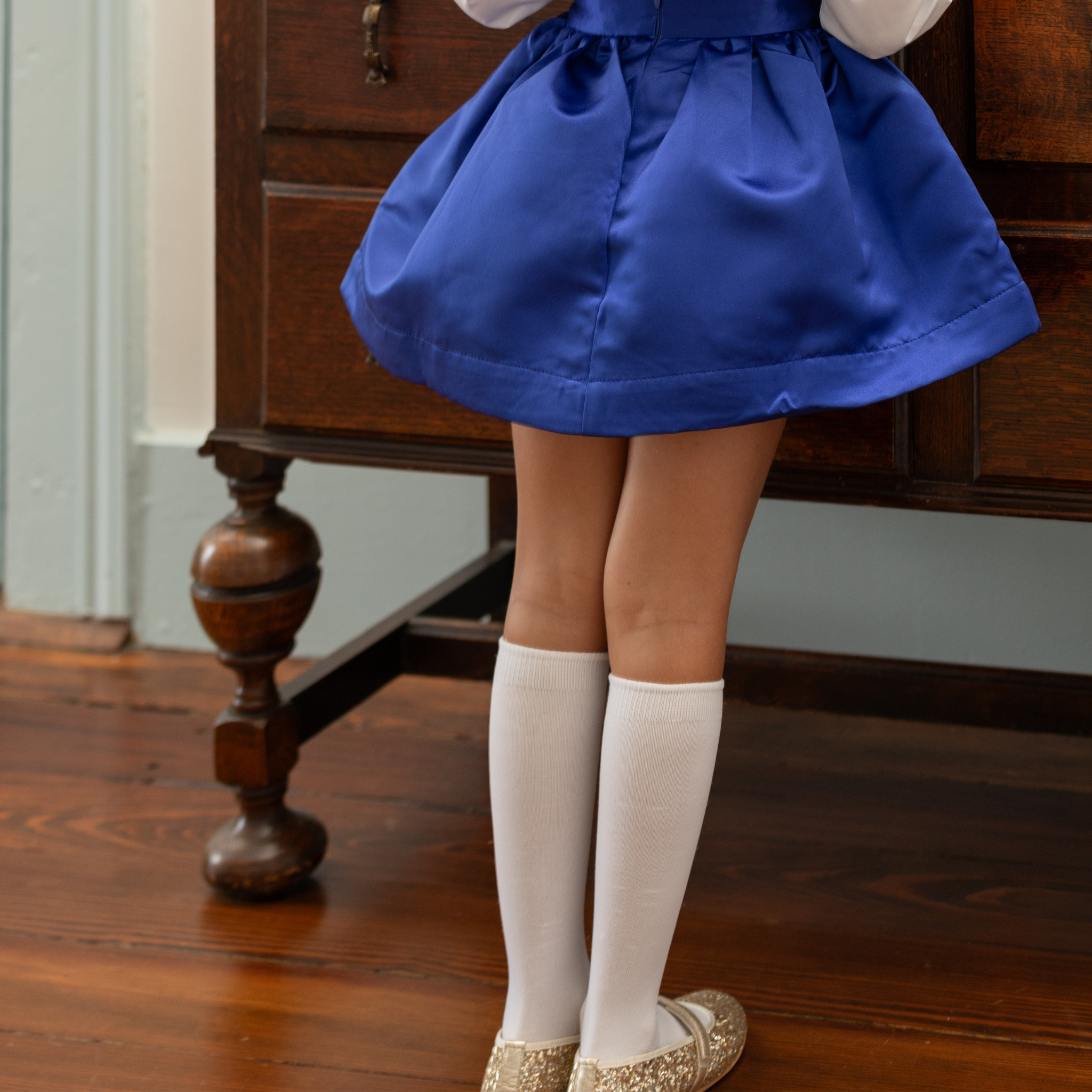 Classic white nylon knee high socks for girls and toddlers, lightweight with ribbed stay-up top, designed for comfort and perfect fit, ideal for pairing with Mary Janes or dress shoes from Henry Duvall’s Fall Collection