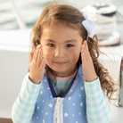 Girls’ long sleeve rashguard one piece swimsuit in Seaside Seersucker with UPF 50+ and scalloped open back, perfect for summer or beach vacations by Henry Duvall.