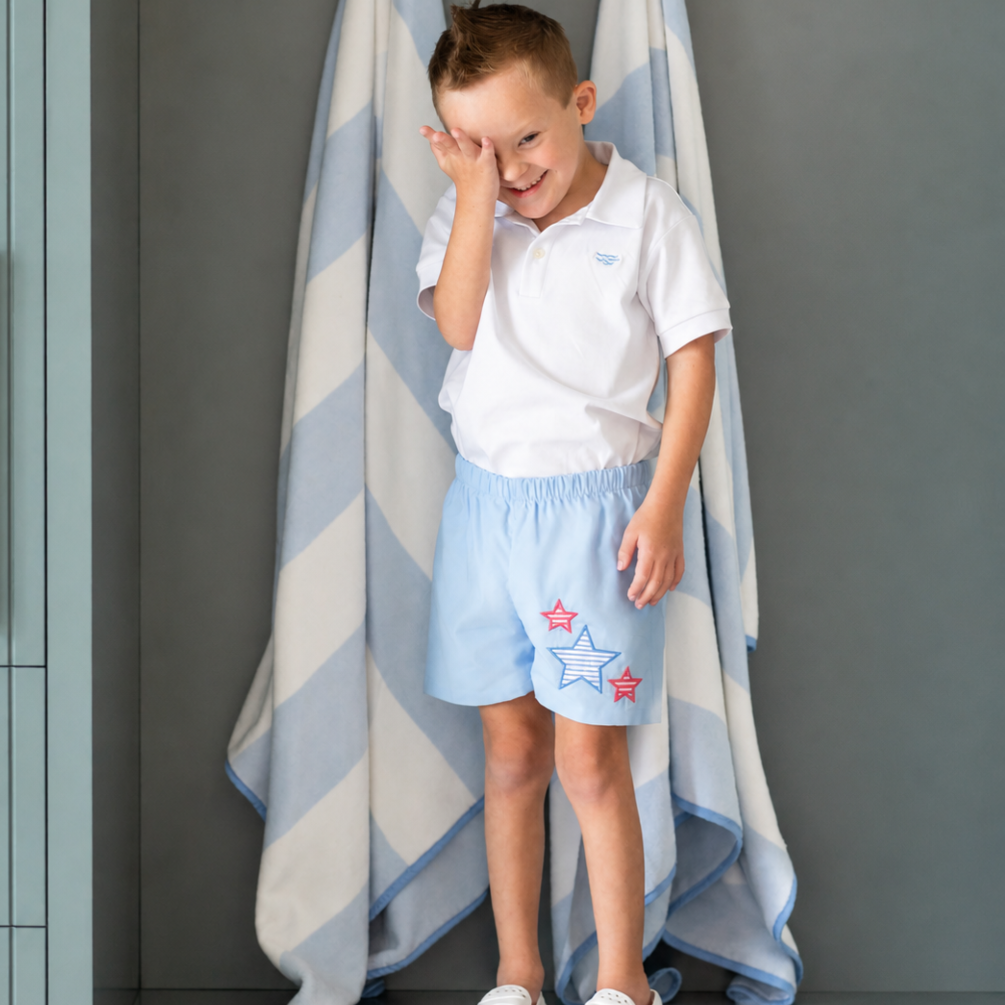 Henry Duvall Liam boys shorts in blue with red white and blue star embroidery, classic preppy patriotic shorts for Memorial Day, 4th of July, and summer wear