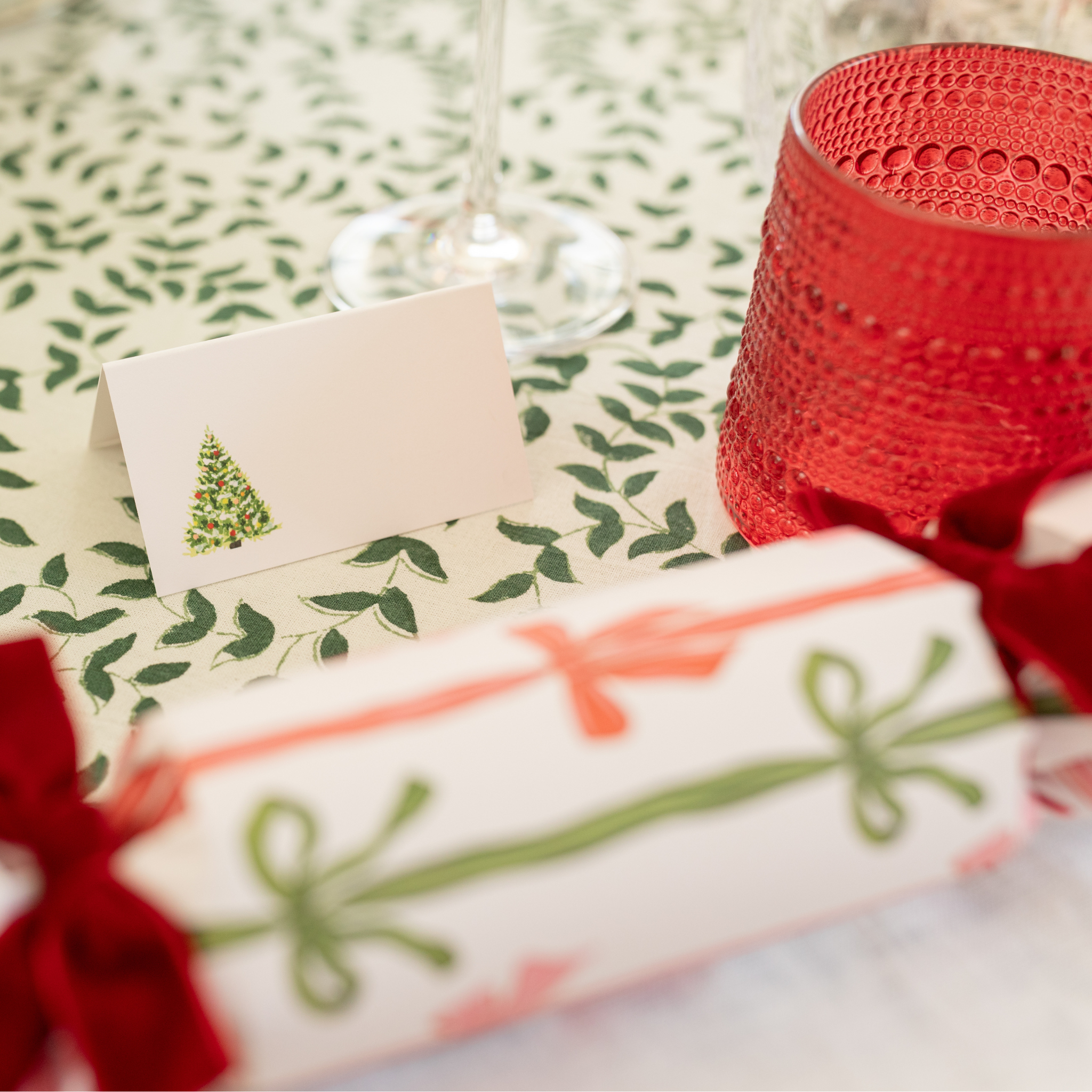 Folded Christmas place card with hand-painted watercolor tree design on heavyweight white cardstock, perfect for holiday tablescapes and festive place settings