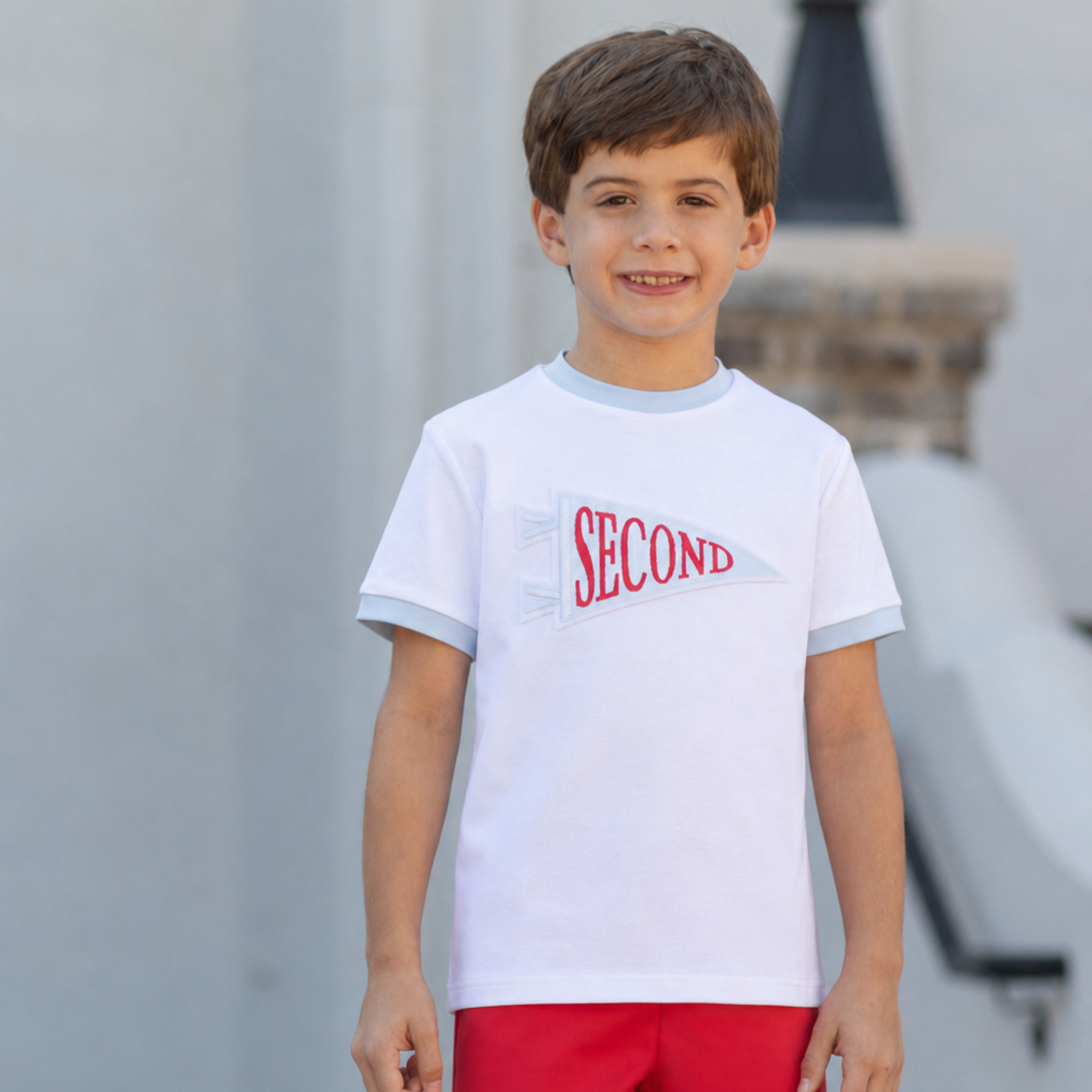 Henry Duvall Pennant Tee featuring appliqué grade pennant, classic back-to-school shirt for kindergarten through fifth grade, perfect for first day of school photos and school milestone celebrations.