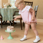 Henry Duvall Rosie Bubble for baby girls in pink piqué, a classic baby girls bubble with lace angel sleeves and satin bow details.