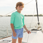 Classic boys’ swim trunks by Henry Duvall in a tailored above-the-knee fit with UPF 50+ protection, featuring an elastic waistband and drawstring for a comfortable summer look.