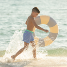 Classic boys’ swim trunks by Henry Duvall in a tailored above-the-knee fit with UPF 50+ protection, featuring an elastic waistband and drawstring for a comfortable summer look.