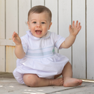 Henry Duvall Charlie Bubble for boys in white cotton with Bailey’s Bay Blue trim and smocked sailboat, classic summer baby boy outfit with Peter Pan collar