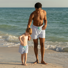 Men’s classic swim trunks by Henry Duvall in matching family prints, featuring UPF 50+ sun protection and an above-the-knee fit.