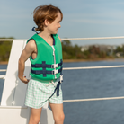 Classic boys’ swim trunks by Henry Duvall in a tailored above-the-knee fit with UPF 50+ protection, featuring an elastic waistband and drawstring for a comfortable summer look.