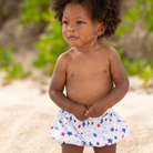 Henry Duvall baby swim shorties in red white and blue star print, patriotic UPF 50+ baby swim bloomers for Memorial Day, 4th of July, beach vacations, and summer wear