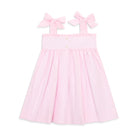 Henry Duvall Daisy Dress in blush pink cotton with hand-smocked crayon embroidery and shoulder bow ties, classic girls back-to-school dress for first day of school photos and fall occasions.