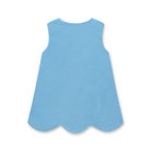 Henry Duvall Janie Jumper girls’ dress in Brookhaven Blue corduroy with scalloped hem and fabric-covered shoulder buttons, designed for layering with blouses and turtlenecks for fall.
