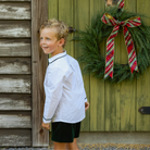 
Sullivan Shorts Set for boys in Grafton Green Velvet, featuring a white long-sleeve Peter Pan collar shirt with green piping and coordinating green velvet shorts.