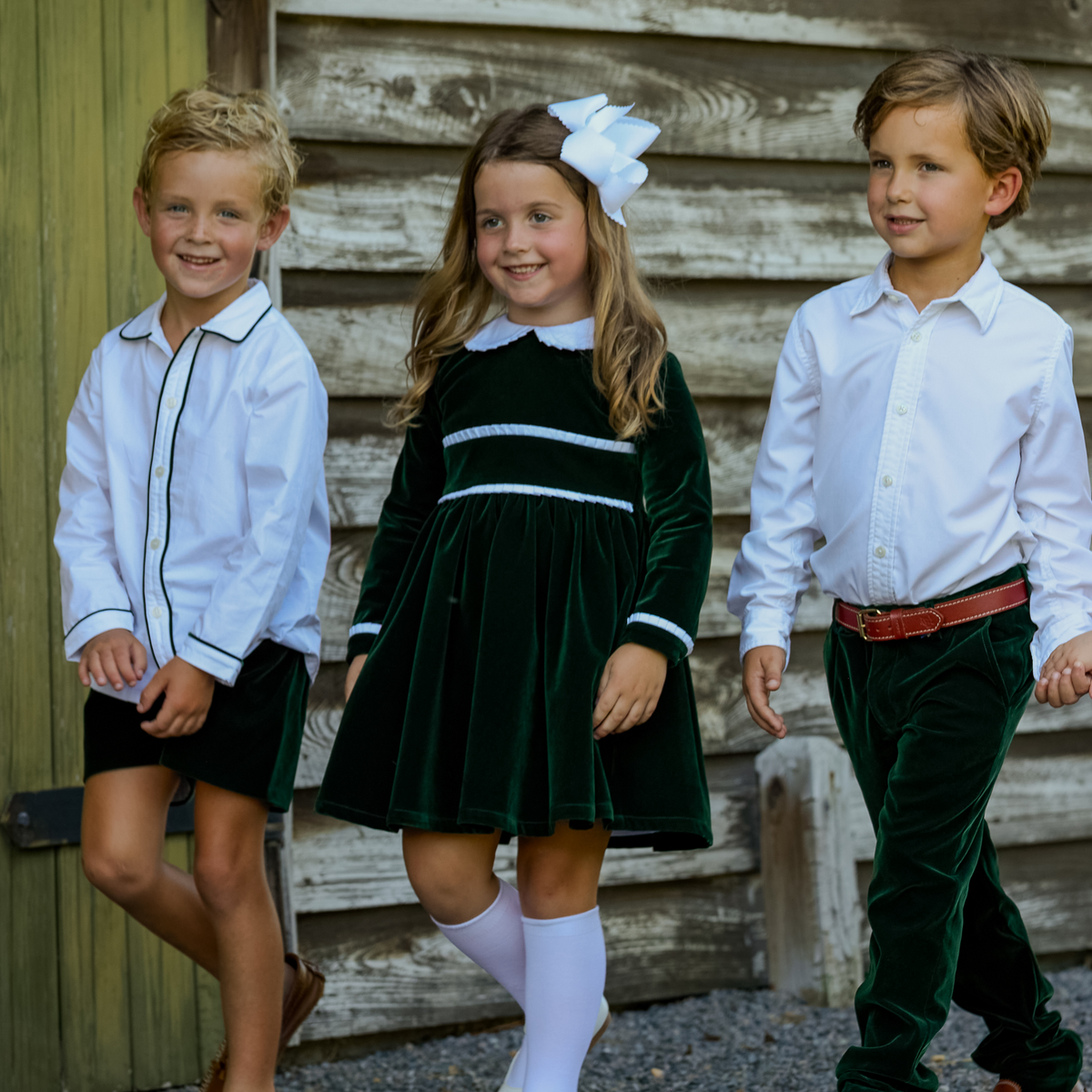 
Sullivan Shorts Set for boys in Grafton Green Velvet, featuring a white long-sleeve Peter Pan collar shirt with green piping and coordinating green velvet shorts.