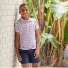 Henry Duvall boys patriotic performance polo with red white and blue fireworks and flag print, preppy UPF summer shirt for Memorial Day, 4th of July, and everyday wear