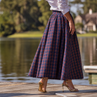 Women’s Audrey Skirt in navy, red, and green Tinsel Tartan with subtle metallic thread, featuring a full gathered midi-length silhouette.