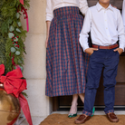 Women’s Audrey Skirt in navy, red, and green Tinsel Tartan with subtle metallic thread, featuring a full gathered midi-length silhouette.