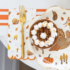 Thanksgiving dinner napkins with festive icons including pumpkins, leaves, and turkeys, set of 24 paper napkins for fall and holiday entertaining