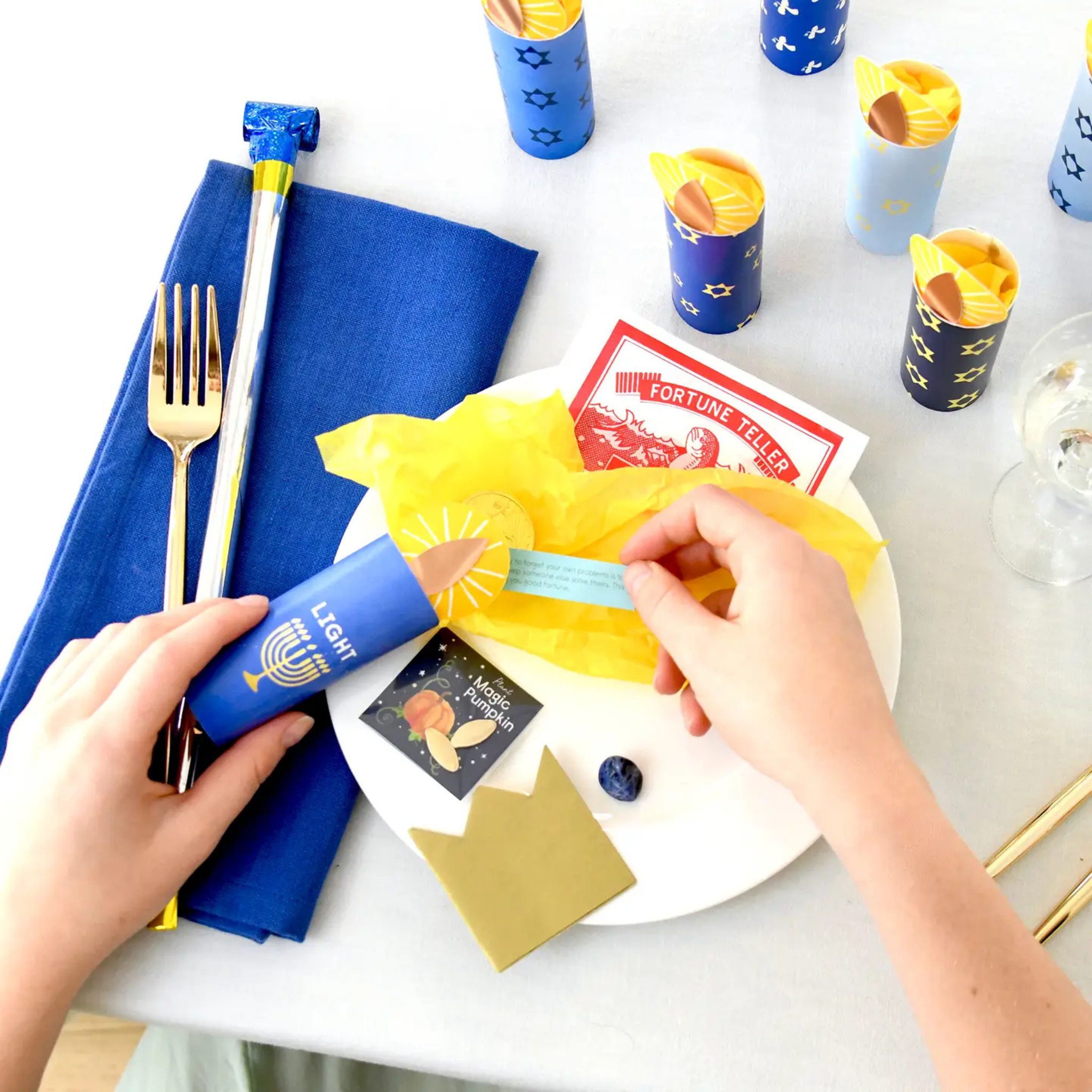 Handcrafted Hanukkah Surprize Candle with hidden treasures inside; artisan-made and refillable, designed for festive gifting and joyful holiday traditions