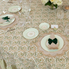 Wheat gingham placemat with scalloped edge embroidery, styled for a classic Thanksgiving table