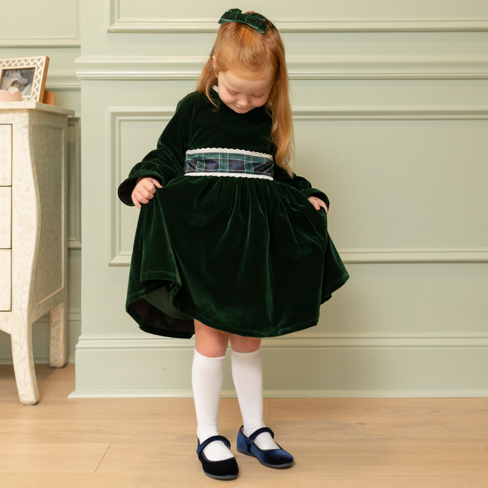 Henry Duvall Eliza Dress for girls in Grafton Green Velvet with white scalloped trim and a Newbury Tartan pre-tied sash, classic holiday dress for festive occasions