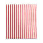 Classic red and white striped Christmas table runner, perfect for festive holiday tablescapes and seasonal dining decor