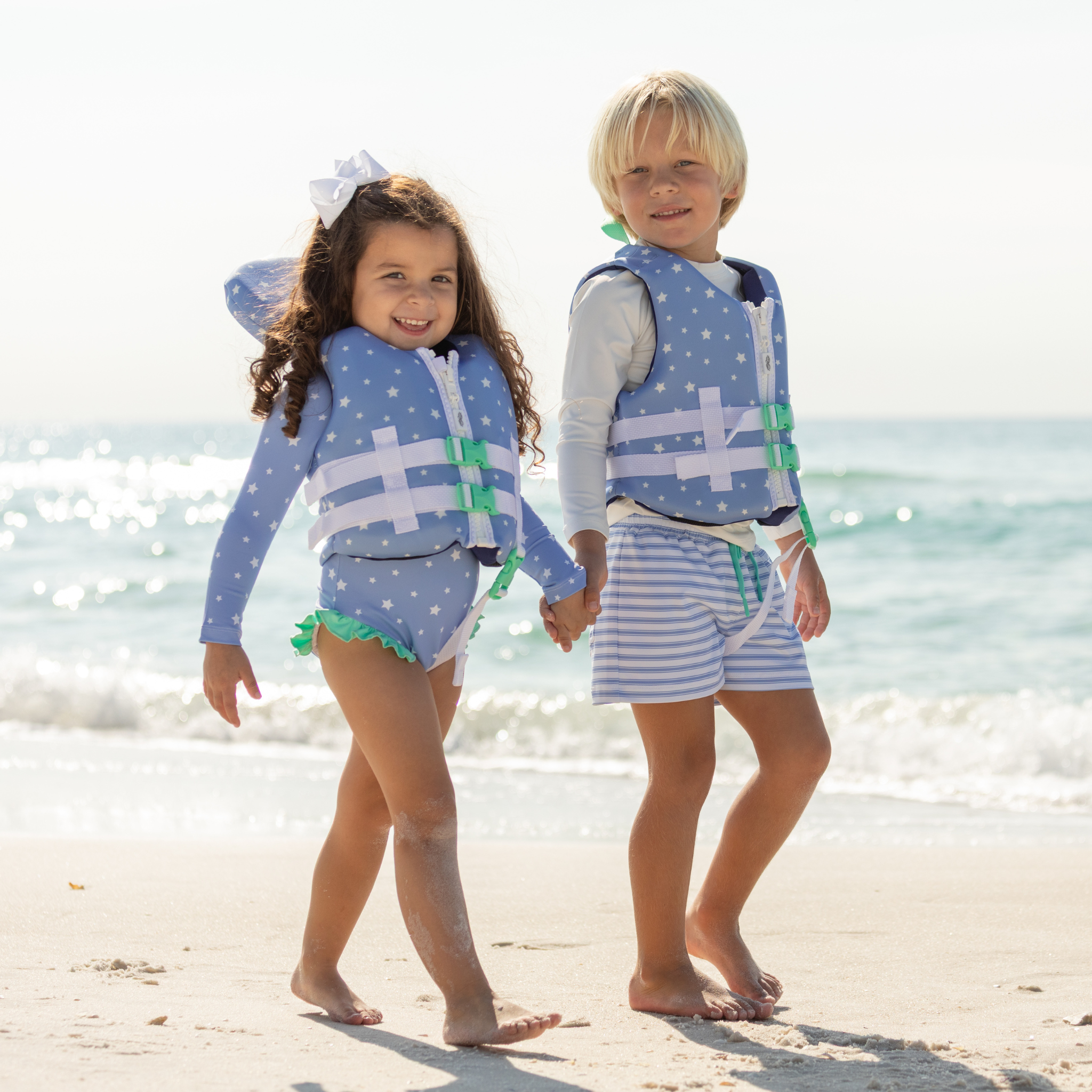 Classic boys’ swim trunks by Henry Duvall in a tailored above-the-knee fit with UPF 50+ protection, featuring an elastic waistband and drawstring for a comfortable summer look.