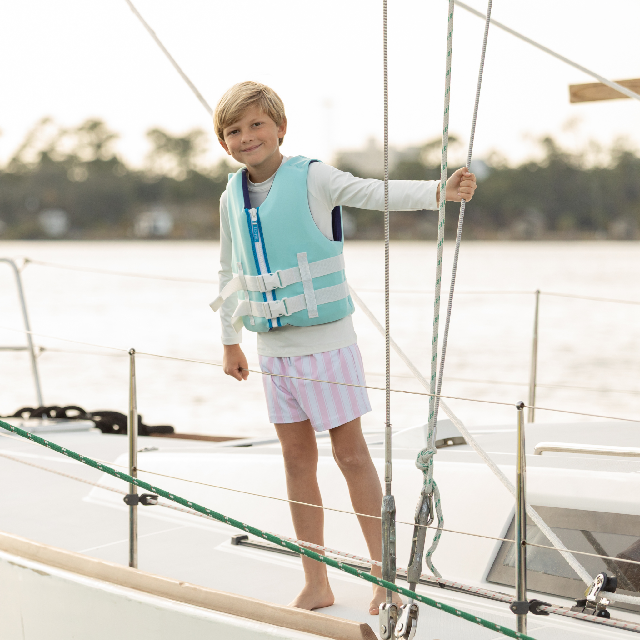 Classic boys’ swim trunks by Henry Duvall in a tailored above-the-knee fit with UPF 50+ protection, featuring an elastic waistband and drawstring for a comfortable summer look.
