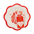 Set of three reusable red and cream Christmas bamboo plates with scalloped edges, featuring vintage-style illustrations of Santa Claus, reindeer, and a sleigh ride