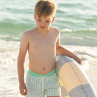 Classic boys’ swim trunks by Henry Duvall in a tailored above-the-knee fit with UPF 50+ protection, featuring an elastic waistband and drawstring for a comfortable summer look.