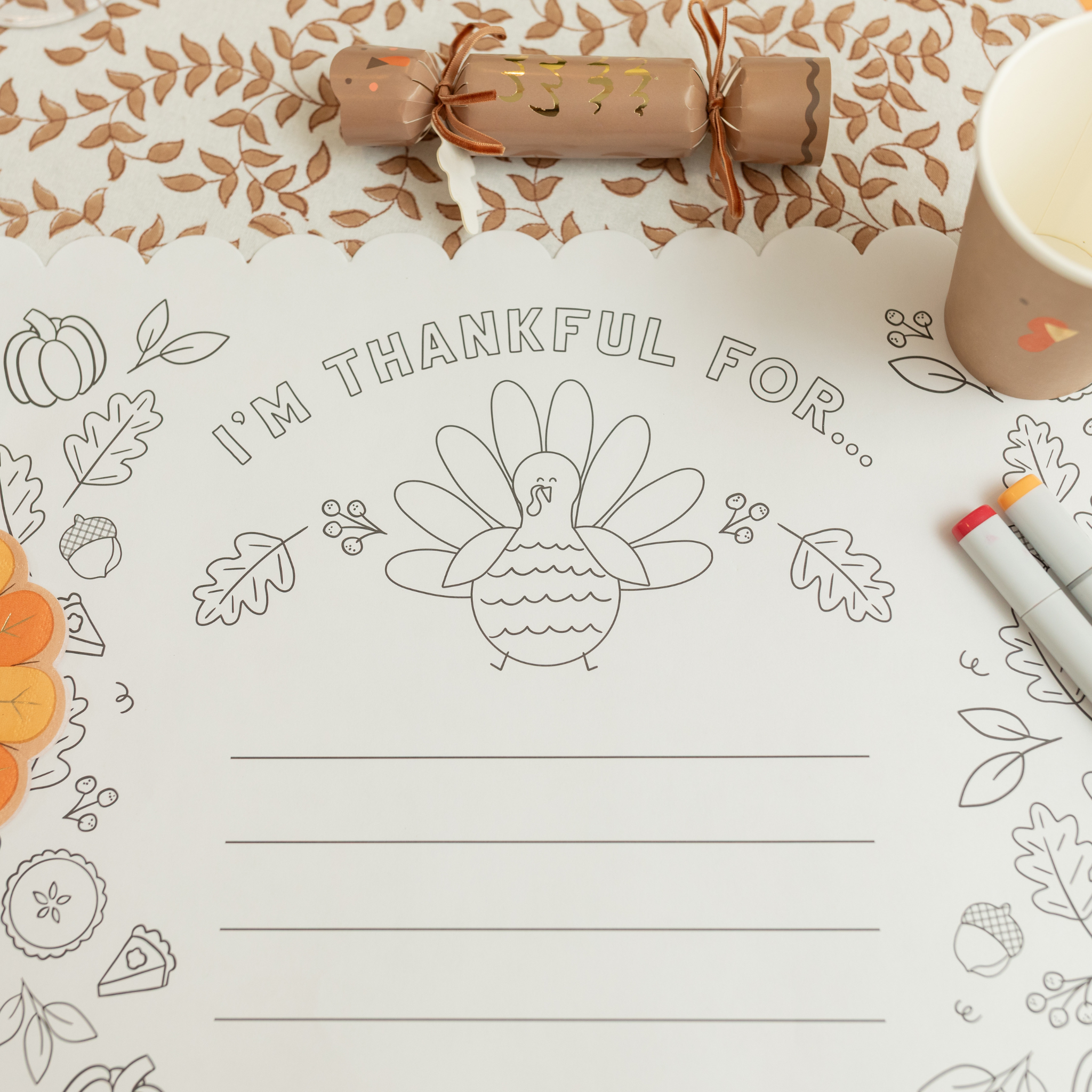 Thanksgiving coloring placemat for kids with turkeys, pumpkins, and “I Am Thankful For” writing prompt – pack of 24