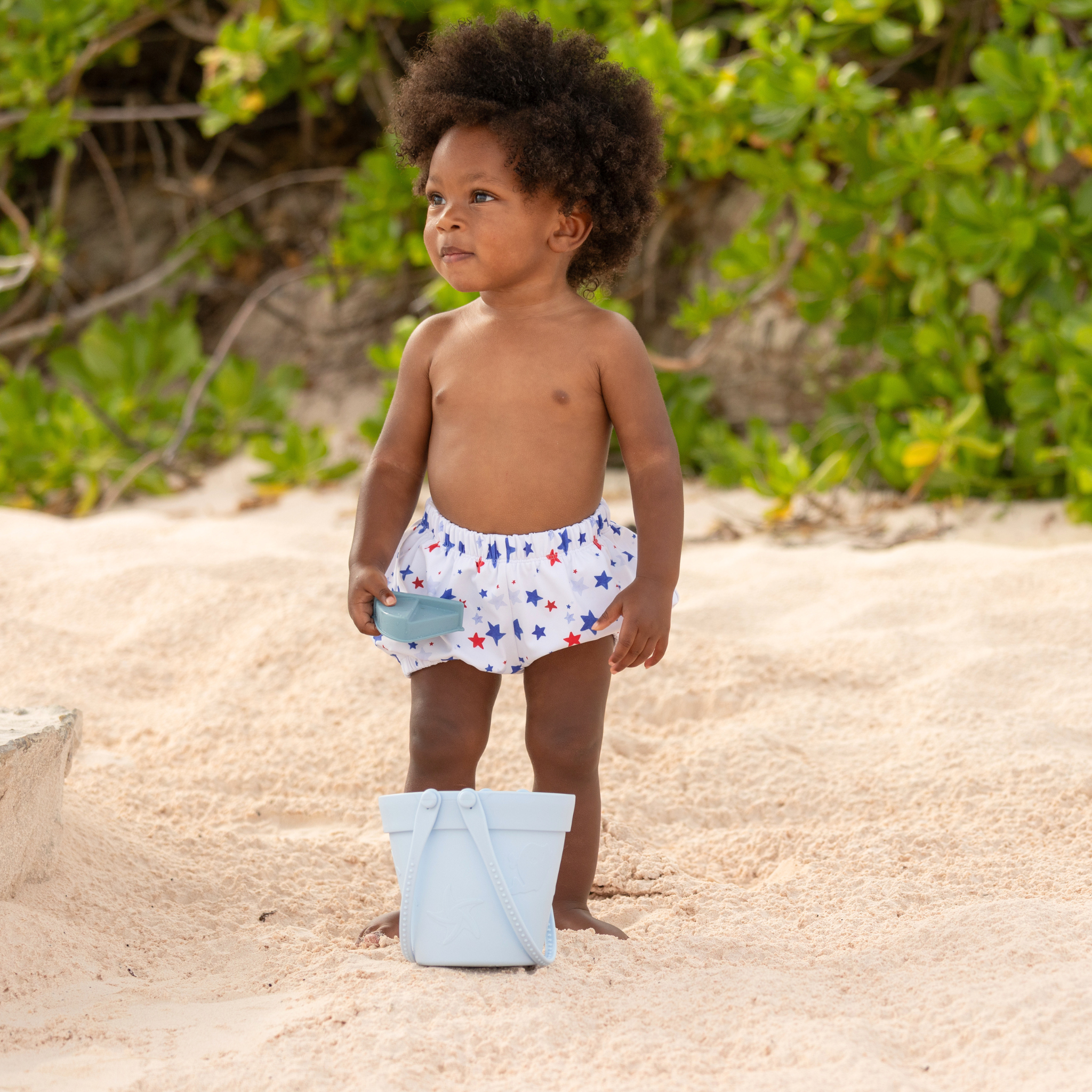Henry Duvall baby swim shorties in red white and blue star print, patriotic UPF 50+ baby swim bloomers for Memorial Day, 4th of July, beach vacations, and summer wear