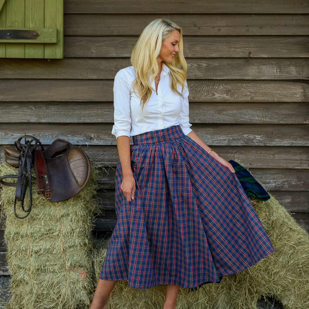 Women’s Audrey Skirt in navy, red, and green Tinsel Tartan with subtle metallic thread, featuring a full gathered midi-length silhouette.