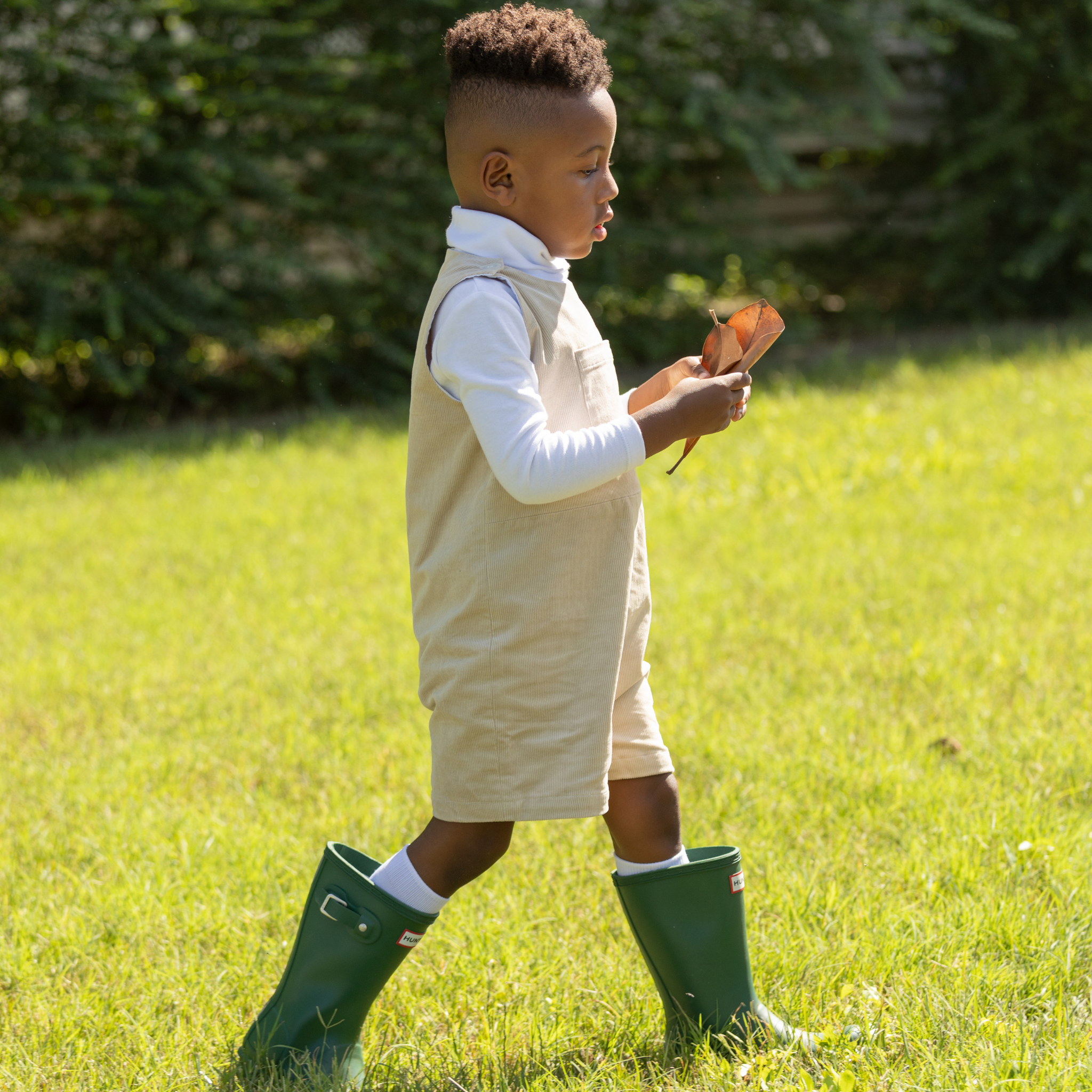 Henry Duvall Oliver Overalls in King’s Way Khaki Corduroy, classic toddler boys fall outfit with relaxed fit, perfect for layering with Peter Pan shirts or coordinating sibling looks