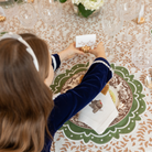 Gold pumpkin-shaped place card holder on a fall-themed table setting.