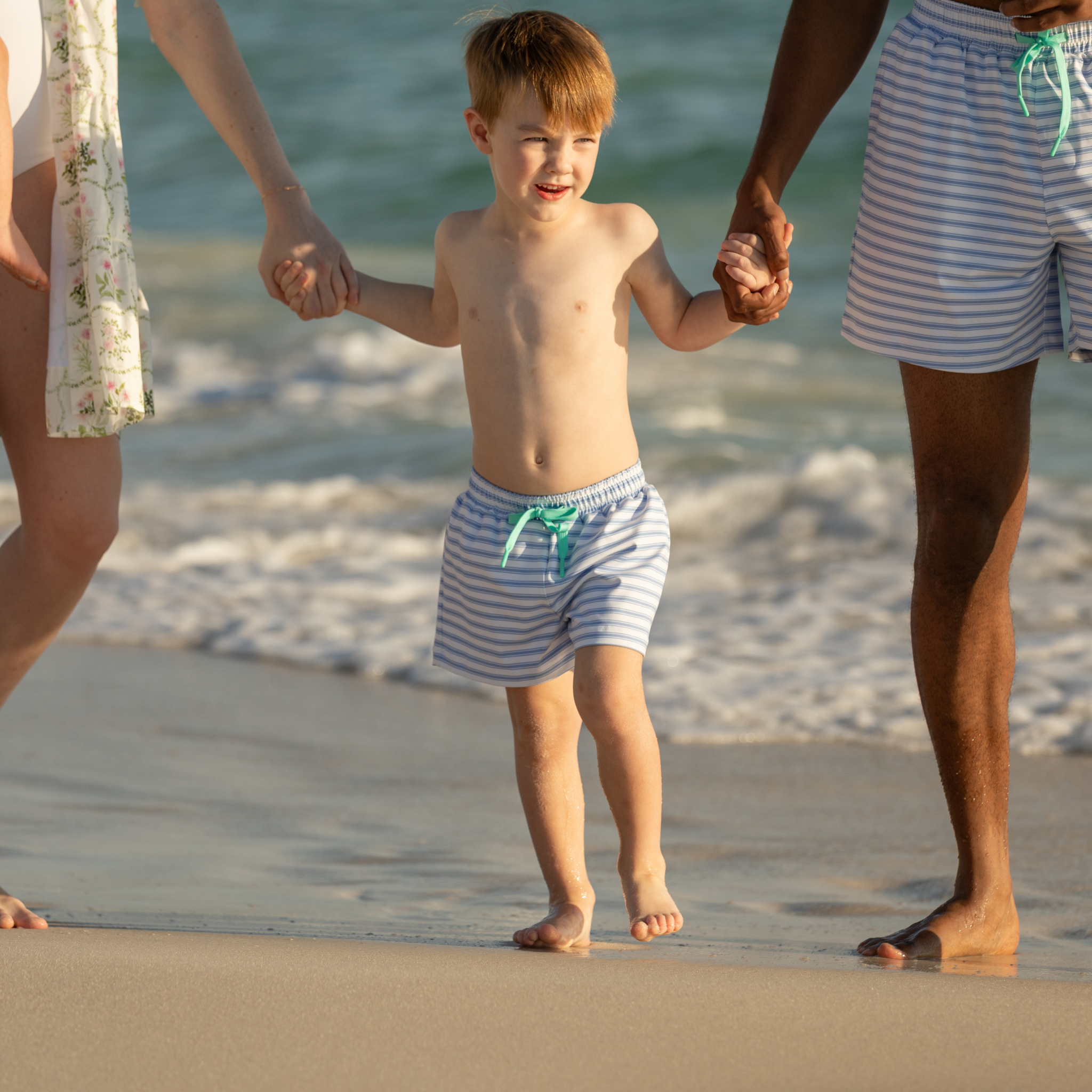 Classic boys’ swim trunks by Henry Duvall in a tailored above-the-knee fit with UPF 50+ protection, featuring an elastic waistband and drawstring for a comfortable summer look.