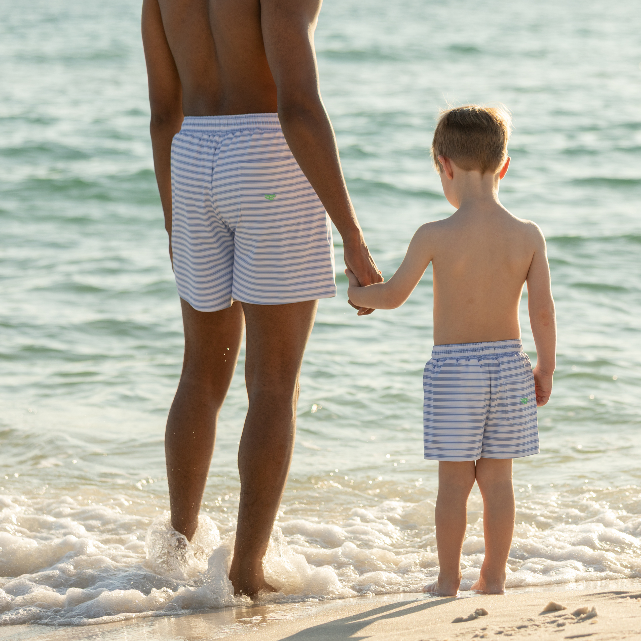 Men’s classic swim trunks by Henry Duvall in matching family prints, featuring UPF 50+ sun protection and an above-the-knee fit.