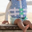 Stylish Henry Duvall x Line + Cleat infant life jacket in blue star print with neck pillow support, zipper front, and adjustable straps