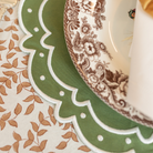 Classic round green scalloped placemats with white embroidery, perfect for Thanksgiving or holiday table settings, handcrafted from a premium cotton blend.
