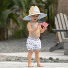 Henry Duvall baby swim shorties in red white and blue star print, patriotic UPF 50+ baby swim bloomers for Memorial Day, 4th of July, beach vacations, and summer wear