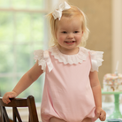 Henry Duvall Rosie Bubble for baby girls in pink piqué, a classic baby girls bubble with lace angel sleeves and satin bow details.