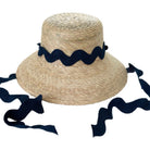 Straw hat with navy blue ribbon on a white background